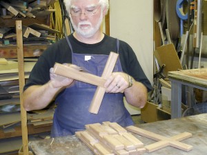 in wood shop  making crosses for the 3 ball gospel illustration